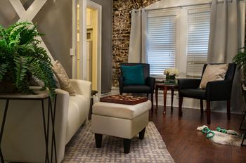 Brookmore Apartment Interior with Wood Floors and Exposed Brick